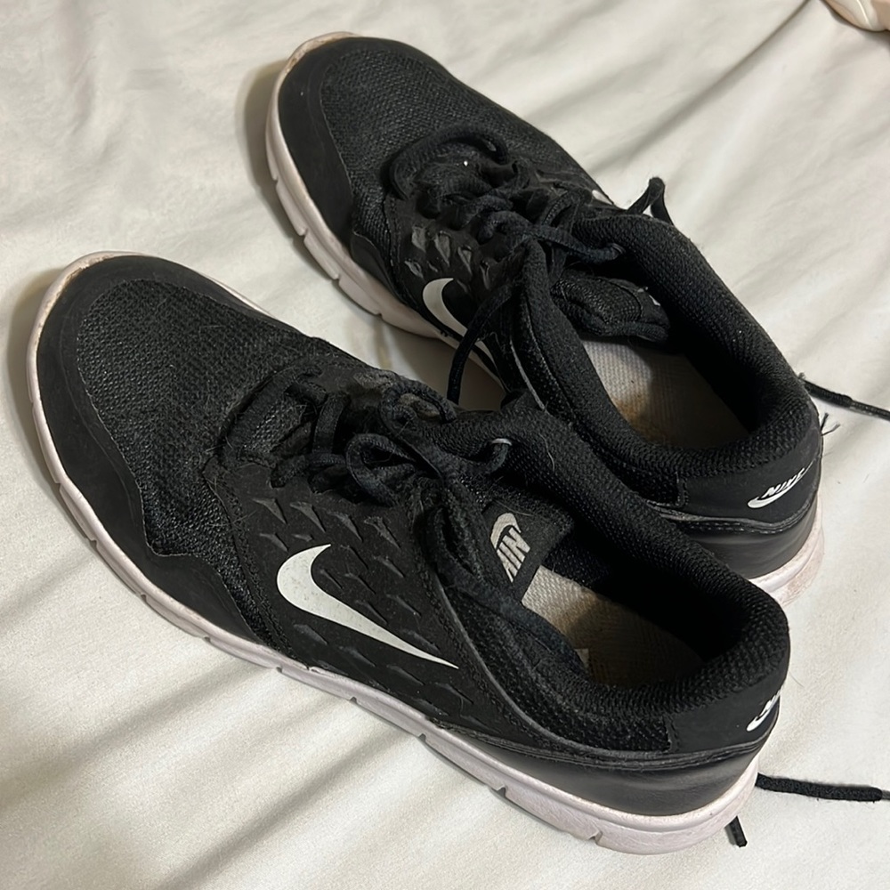 Slightly worn Nike tennis shoes